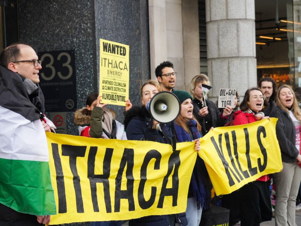 Read more about the article activists protest profiteering from climate crisis and genocide