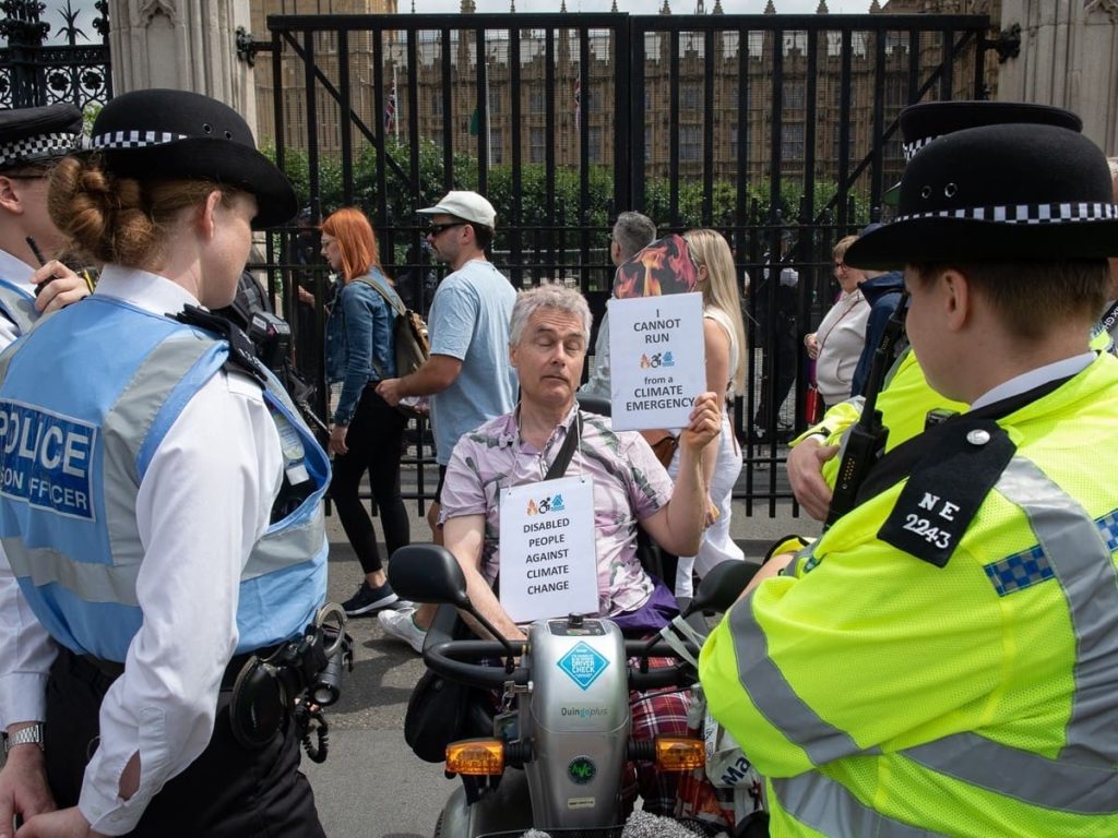 Read more about the article Disabled activist prosecuted for blocking parliament with scooter